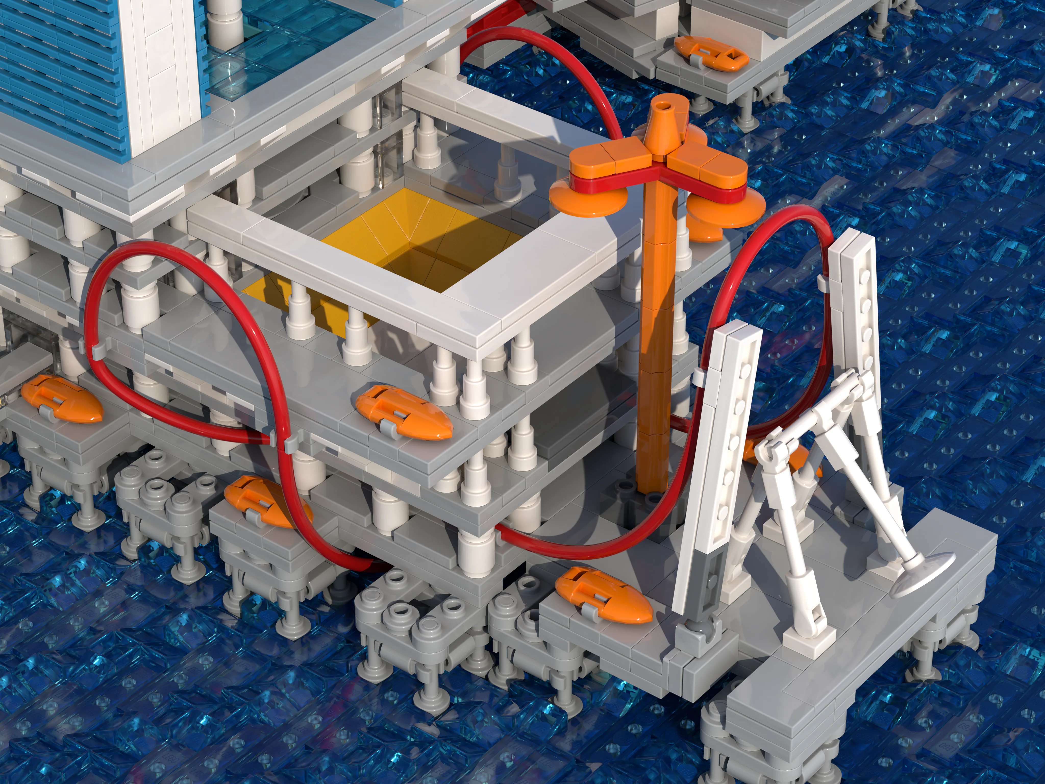 Another side of The Derrick platform of the LEGO model, with its red pipes, orange tower and square opening onto the sea
